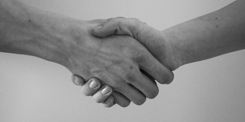 Firm handshake between a man and woman